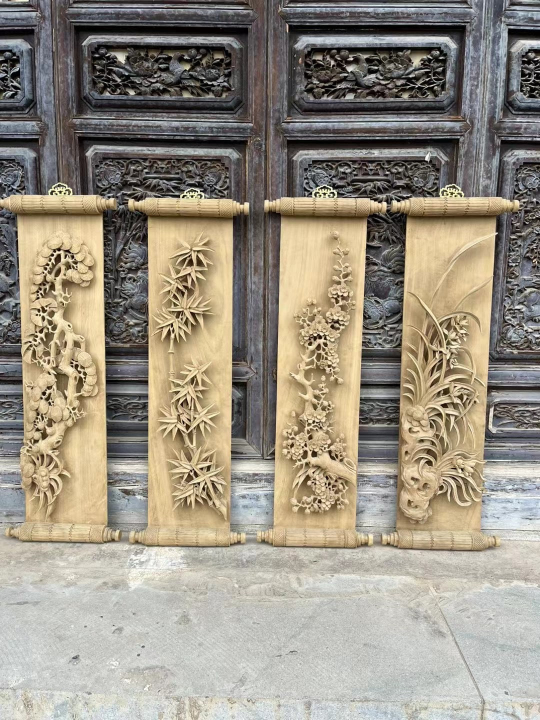 Hand carved pine trees, bamboo, plum blossoms, and orchids